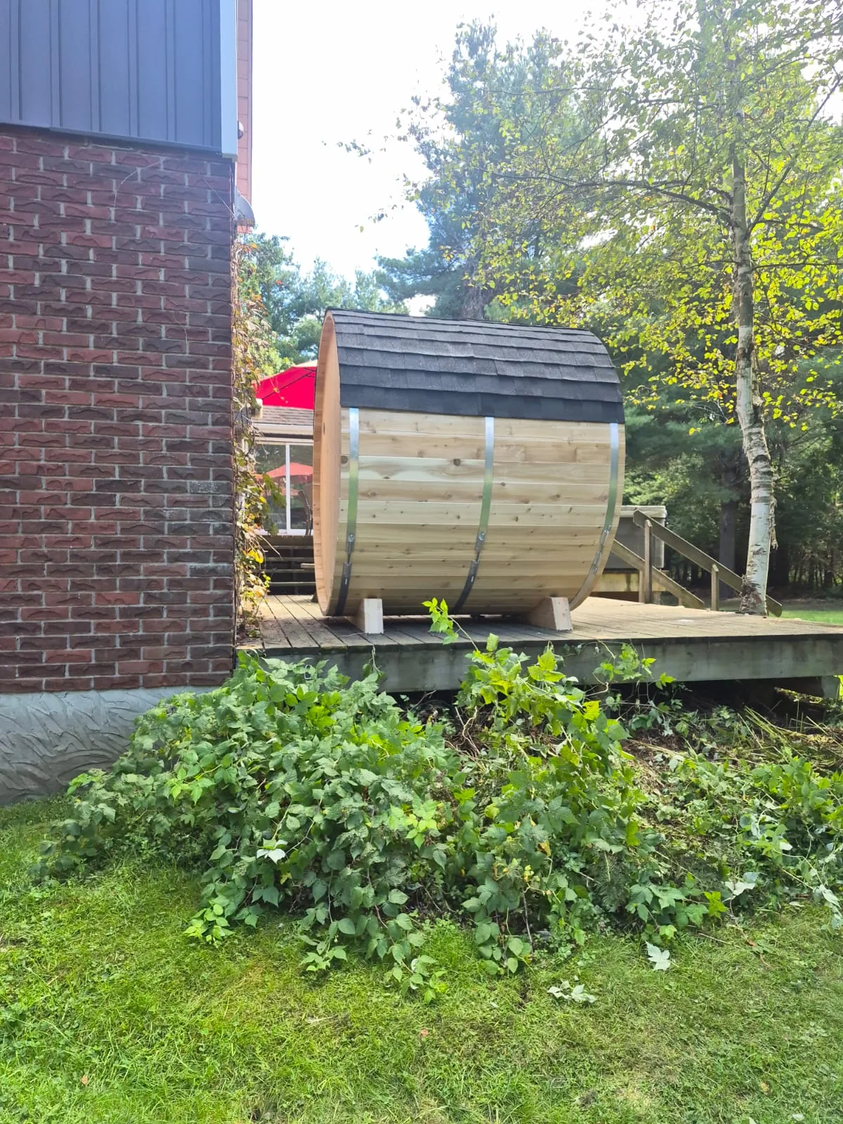 Installed barrel side with dark roof on a deck