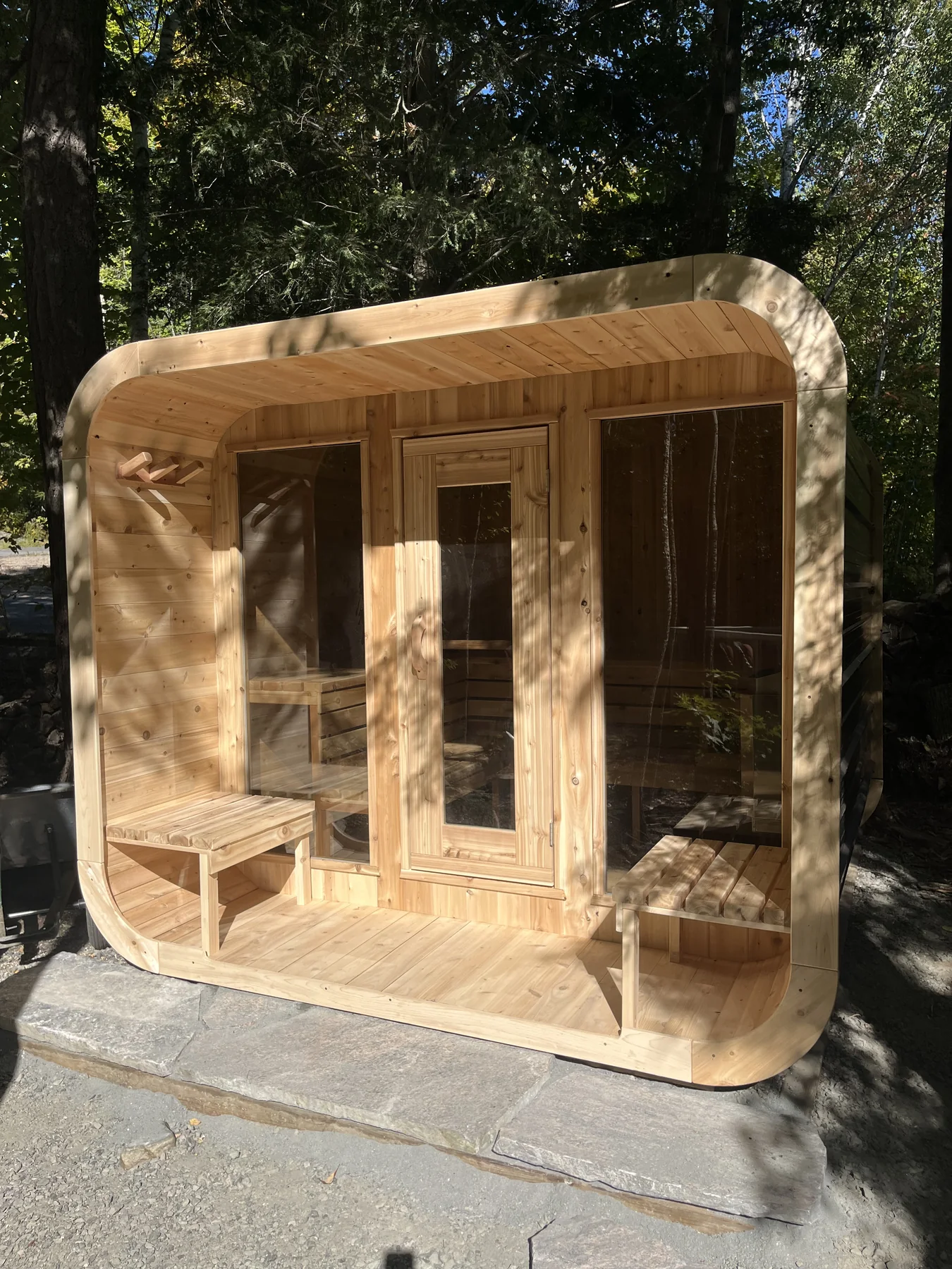 Rounded wide Luna with front door and porch benches